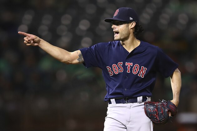 Boston Red Sox pitcher Joe Kelly celebrates the 7-3 win over the Oakland Athletics at the end of a baseball game Friday, April 20, 2018, in Oakland, Calif. (AP Photo/Ben Margot)
