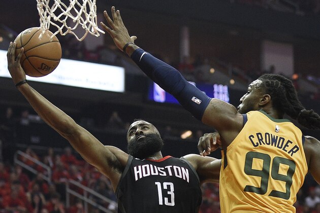 Houston Rockets guard James Harden (13) drives to the basket as Utah Jazz forward Jae Crowder defends during the first half in Game 1 of an NBA basketball second-round playoff series, Sunday, April 29, 2018, in Houston. (AP Photo/Eric Christian Smith)