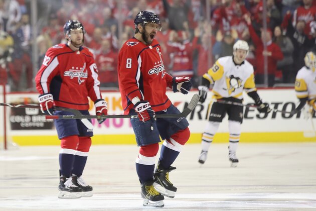 WASHINGTON, DC - APRIL 26:  Alex Ovechkin #8 of the Washington Capitals celebrates a goal by Evgeny Kuznetsov #92 against the Pittsburgh Penguins in Game One of the Eastern Conference Second Round during the 2018 NHL Stanley Cup Playoffs at the Capital One Arena on April 26, 2018 in Washington, DC. The Penguins defeated the Capitals 3-2.  (Photo by Bruce Bennett/Getty Images)