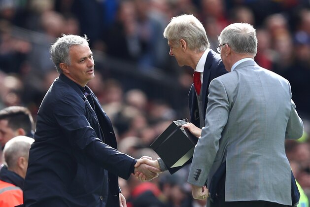 MANCHESTER, ENGLAND - APRIL 29:  Sir Alex Ferguson and Jose Mourinho, Manager of Manchester United greet Arsene Wenger, Manager of Arsenal pitchside prior to the Premier League match between Manchester United and Arsenal at Old Trafford on April 29, 2018 in Manchester, England.  (Photo by Clive Brunskill/Getty Images)