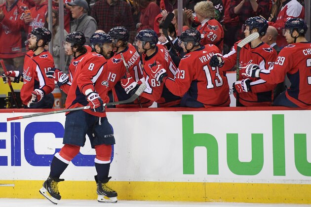 Washington Capitals left wing Alex Ovechkin (8), of Russia, celebrates his goal with the bench during the first period in Game 2 of an NHL second-round hockey playoff series against the Pittsburgh Penguins, Sunday, April 29, 2018, in Washington. (AP Photo/Nick Wass)