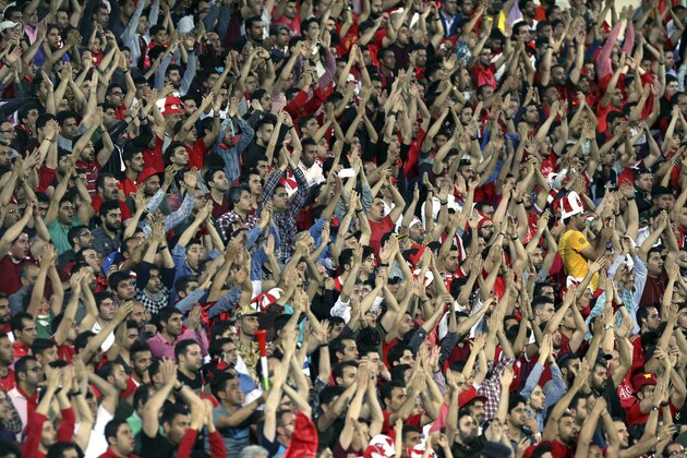 Persepolis soccer fans applaud their team during their AFC Champions League soccer match against Al Wahda at the Azadi stadium in Tehran, Iran, Monday, May, 8, 2017. Persepolis won the match 4-2. (AP Photo/Vahid Salemi)
