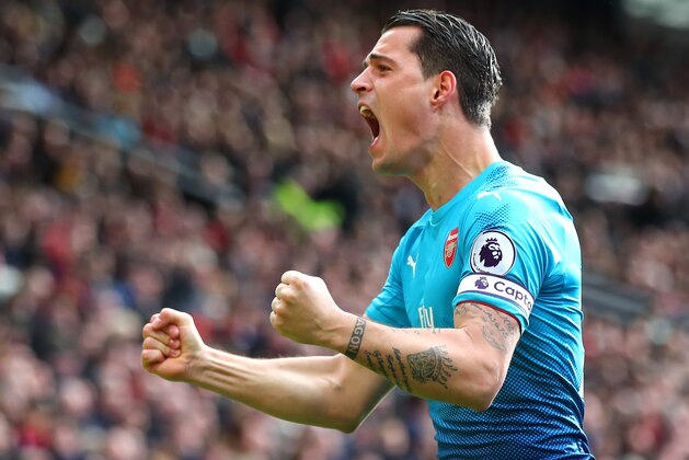MANCHESTER, ENGLAND - APRIL 29: Granit Xhaka of Arsenal celebrates his sides second goal during the Premier League match between Manchester United and Arsenal at Old Trafford on April 29, 2018 in Manchester, England.  (Photo by Clive Brunskill/Getty Images)
