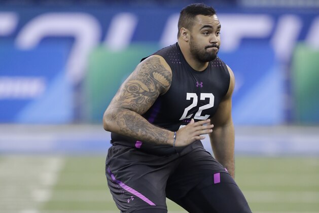 LSU offensive lineman K J Malone runs a drill during the NFL football scouting combine, Friday, March 2, 2018, in Indianapolis. (AP Photo/Darron Cummings)