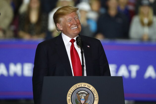 President Donald Trump smiles during a campaign rally in Washington Township, Mich., Saturday, April 28, 2018. (AP Photo/Paul Sancya)