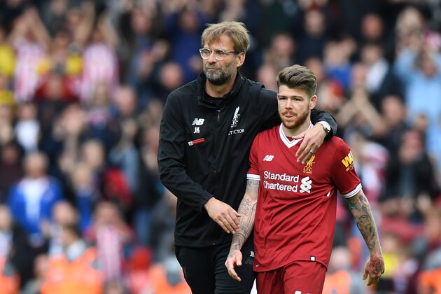 Liverpool's German manager Jurgen Klopp (L) walks with Liverpool's Spanish defender Alberto Moreno during the English Premier League football match between Liverpool and Stoke City at Anfield in Liverpool, north west England on April 28, 2018. (Photo by Paul ELLIS / AFP) / RESTRICTED TO EDITORIAL USE. No use with unauthorized audio, video, data, fixture lists, club/league logos or 'live' services. Online in-match use limited to 75 images, no video emulation. No use in betting, games or single club/league/player publications. /         (Photo credit should read PAUL ELLIS/AFP/Getty Images)