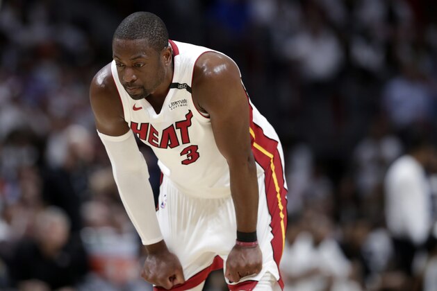Miami Heat's Dwyane Wade (3) stands on the court during the second half of Game 3 of a first-round NBA basketball playoff series against the Philadelphia 76ers, Thursday, April 19, 2018, in Miami. The 76ers won 128-108. (AP Photo/Lynne Sladky)