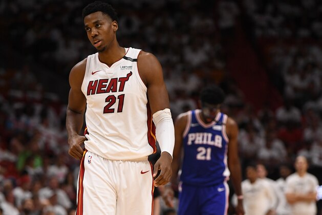 MIAMI, FL - APRIL 21: Hassan Whiteside #21 of the Miami Heat and Joel Embiid #21 of the Philadelphia 76ers in the third quarter during Game Four of Round One of the 2018 NBA Playoffs between the Miami Heat and the Philadelphia 76ers at American Airlines Arena on April 21, 2018 in Miami, Florida. NOTE TO USER: User expressly acknowledges and agrees that, by downloading and or using this photograph, User is consenting to the terms and conditions of the Getty Images License Agreement. (Photo by Mark Brown/Getty Images) *** Local Caption *** Hassan Whiteside; Joel Embiid