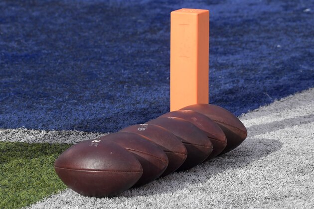 Practice footballs sit on the field before an NFL football game between the New York Giants and the Washington Redskins Sunday, Dec. 31, 2017, in East Rutherford, N.J. (AP Photo/Bill Kostroun)