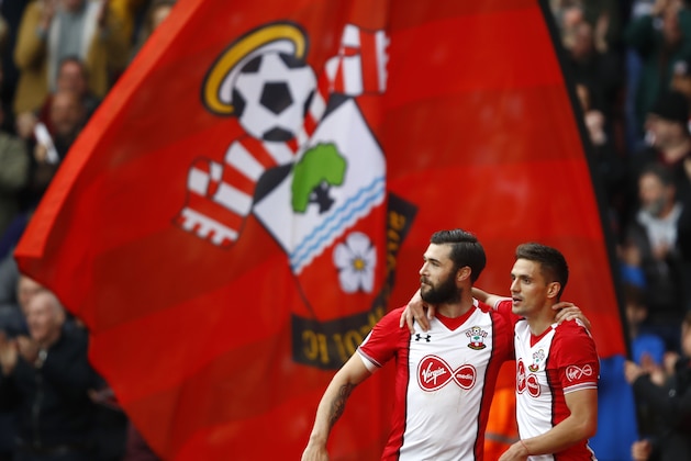 SOUTHAMPTON, ENGLAND - APRIL 28:  Dusan Tadic of Southampton celebrates scoring his side's first goal with Charlie Austin during the Premier League match between Southampton and AFC Bournemouth at St Mary's Stadium on April 28, 2018 in Southampton, England.  (Photo by Julian Finney/Getty Images)