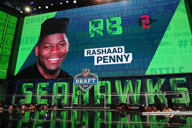 ARLINGTON, TX - APRIL 26:  A video board displays an image of Rashaad Penny of San Diego State after he was picked #27 overall by the Seattle Seahawks during the first round of the 2018 NFL Draft at AT&T Stadium on April 26, 2018 in Arlington, Texas.  (Photo by Tom Pennington/Getty Images)