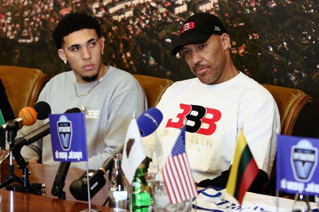 US basketball player LiAngelo Ball and his father LaVar Ball attend a press conference in Prienai, Lithuania, where his sons will play for the Vytautas club on January 5, 2018.
Basketball-crazed Lithuania welcomed LiAngelo and LaMelo Ball, the two youngest sons of flamboyant Los Angeles entrepreneur LaVar Ball who recently made headlines due to a feud with US President Donald Trump. / AFP PHOTO / Petras Malukas        (Photo credit should read PETRAS MALUKAS/AFP/Getty Images)