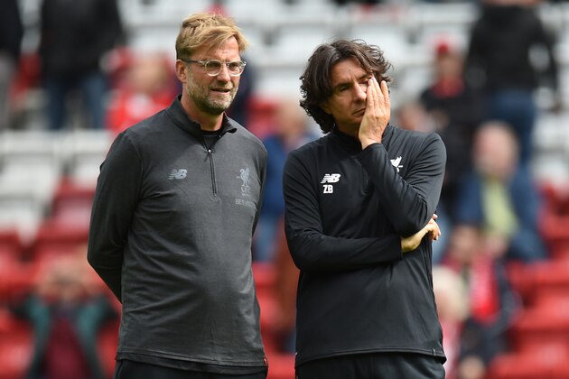 Liverpool's German manager Jurgen Klopp (L) speaks with Liverpool's Serbian assistant manager Zeljko Buvac ahead of the English Premier League football match between Liverpool and Crystal Palace at Anfield in Liverpool, north west England on August 19, 2017. / AFP PHOTO / Oli SCARFF / RESTRICTED TO EDITORIAL USE. No use with unauthorized audio, video, data, fixture lists, club/league logos or 'live' services. Online in-match use limited to 75 images, no video emulation. No use in betting, games or single club/league/player publications.  /         (Photo credit should read OLI SCARFF/AFP/Getty Images)