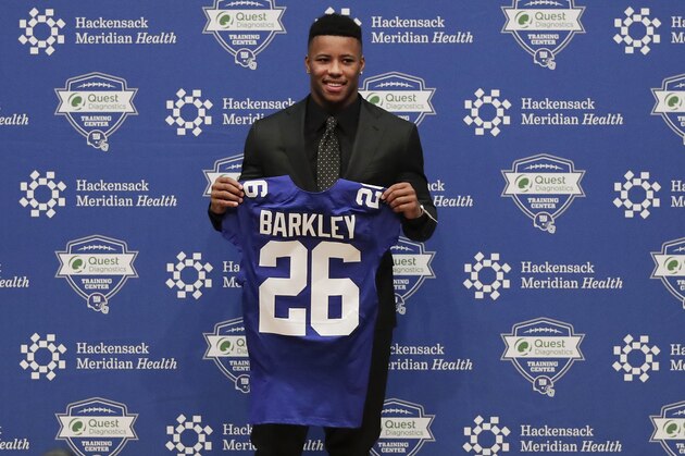 Running back Saquon Barkley poses for photos during a news conference, Saturday, April 28, 2018, in East Rutherford, N.J. Barkley was selected as the number two overall pick in the NFL football draft by the New York Giants. (AP Photo/Julie Jacobson)