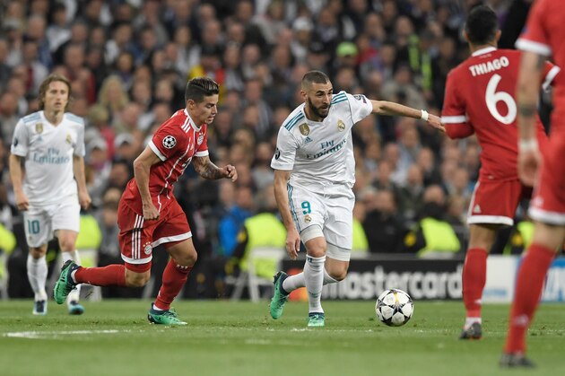 Bayern Munich's Colombian midfielder James Rodriguez (C-L) and Real Madrid's French forward Karim Benzema (C-R) vie for the ball during the UEFA Champions League semi-final second-leg football match Real Madrid CF vs FC Bayern Munich in Madrid, Spain, on May 1, 2018. (Photo by GABRIEL BOUYS / AFP) (Photo credit should read GABRIEL BOUYS/AFP/Getty Images) Bayern Munich's Colombian midfielder James Rodriguez (C-L) and Real Madrid's French forward Karim Benzema (C-R) vie for the ball during the UEFA Champions League semi-final second-leg football match Real Madrid CF vs FC Bayern Munich in Madrid, Spain, on May 1, 2018. (Photo by GABRIEL BOUYS / AFP) (Photo credit should read GABRIEL BOUYS/AFP/Getty Images)