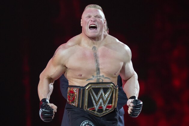 FILE - In this March 29, 2015, file photo, Brock Lesnar makes his entrance at Wrestlemania XXXI in Santa Clara, Calif. Lesnar, the former WWE and UFC heavyweight champion, was selected Monday, June 27, 2016, as the cover superstar for the WWE 2K17 video game that is set for an Oct. 11 release.  (AP Photo/Don Feria, File)