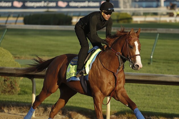 Kentucky Derby hopeful Justify runs during a morning workout at Churchill Downs Tuesday, May 1, 2018, in Louisville, Ky. The 144th running of the Kentucky Derby is scheduled for Saturday, May 5. (AP Photo/Charlie Riedel)