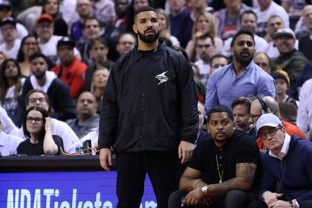 TORONTO, ON - APRIL 25:  Singer Drake watches from his courtside seat during the second half of Game Five between the Washington Wizards and the Toronto Raptors in Round One of the 2018 NBA playoffs at Air Canada Centre on April 25, 2018 in Toronto, Canada.  NOTE TO USER: User expressly acknowledges and agrees that, by downloading and or using this photograph, User is consenting to the terms and conditions of the Getty Images License Agreement.  (Photo by Vaughn Ridley/Getty Images)