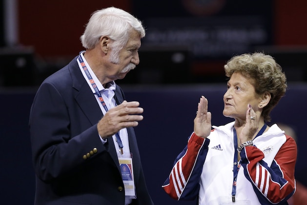 FILE - In this June 29, 2012, file photo, Bela Karolyi, left, and his wife Martha Karolyi talk on the arena floor before the start of the preliminary round of the women's Olympic gymnastics trials in San Jose, Calif. The latest lawsuit filed Thursday, Oct. 27, 2016, accusing Dr. Larry Nassar, a former USA Gymnastics doctor, of sexually abusing a longtime member of the U.S. women's national team is the first to name renowned husband-and-wife coaches Bela and Martha Karolyi, alleging they turned a blind eye to molestations. The Karolyis did not return messages seeking comment. (AP Photo/Gregory Bull, File)