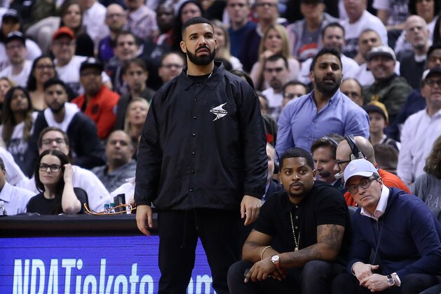 TORONTO, ON - APRIL 25:  Singer Drake watches from his courtside seat during the second half of Game Five between the Washington Wizards and the Toronto Raptors in Round One of the 2018 NBA playoffs at Air Canada Centre on April 25, 2018 in Toronto, Canada.  NOTE TO USER: User expressly acknowledges and agrees that, by downloading and or using this photograph, User is consenting to the terms and conditions of the Getty Images License Agreement.  (Photo by Vaughn Ridley/Getty Images)