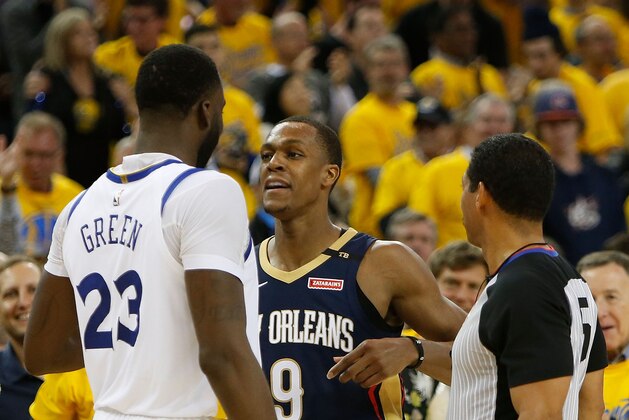 OAKLAND, CA - APRIL 28: Draymond Green #23 of the Golden State Warriors and Rajon Rondo #9 of the New Orleans Pelicans exchange words during Game One of the Western Conference Semifinals at ORACLE Arena on April 28, 2018 in Oakland, California. NOTE TO USER: User expressly acknowledges and agrees that, by downloading and or using this photograph, User is consenting to the terms and conditions of the Getty Images License Agreement. (Photo by Lachlan Cunningham/Getty Images)
