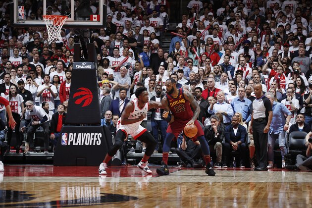 TORONTO, CANADA - MAY 1:  LeBron James #23 of the Cleveland Cavaliers handles the ball against OG Anunoby #3 of the Toronto Raptors in Game One of Round Two of the 2018 NBA Playoffs on May 1, 2018 at the Air Canada Centre in Toronto, Ontario, Canada.  NOTE TO USER: User expressly acknowledges and agrees that, by downloading and or using this Photograph, user is consenting to the terms and conditions of the Getty Images License Agreement.  Mandatory Copyright Notice: Copyright 2018 NBAE (Photo by Mark Blinch/NBAE via Getty Images)