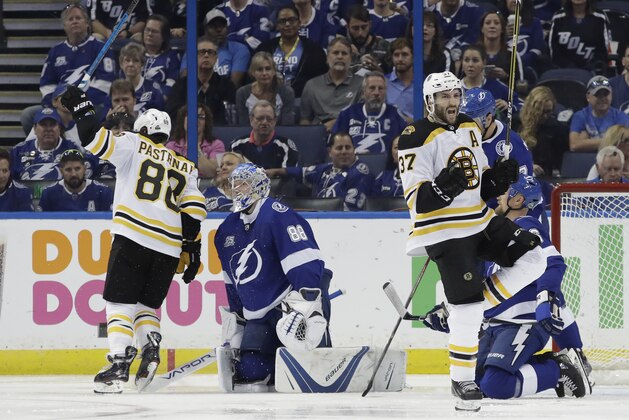 Boston Bruins center Patrice Bergeron (37) celebrates his goal against the Tampa Bay Lightning during the second period of Game 1 of an NHL second-round hockey playoff series Saturday, April 28, 2018, in Tampa, Fla. (AP Photo/Chris O'Meara)