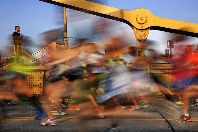Runner's in the Pittsburgh Marathon cross the Rachel Carson Bridge in downtown Pittsburgh Sunday, May 3, 2015. (AP Photo/Gene J. Puskar)