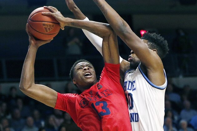 Dayton's Kostas Antetokounmpo (13) goes up to shoot against Rhode Island's Cyril Langevine (10) during the first half of an NCAA college basketball game in South Kingstown, R.I., Friday, Feb. 23, 2018. (AP Photo/Michael Dwyer)