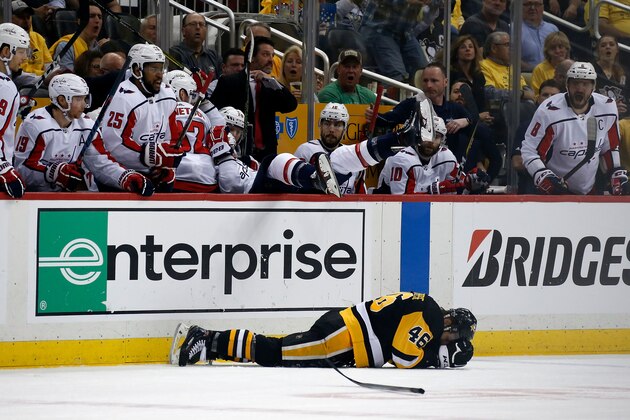 PITTSBURGH, PA - MAY 01:  Zach Aston-Reese #46 of the Pittsburgh Penguins lays on the ice after getting hit by Tom Wilson #43 of the Washington Capitals in Game Three of the Eastern Conference Second Round during the 2018 NHL Stanley Cup Playoffs at PPG PAINTS Arena on May 1, 2018 in Pittsburgh, Pennsylvania. (Photo by Kirk Irwin/Getty Images) *** Local Caption *** Zach Aston-Reese