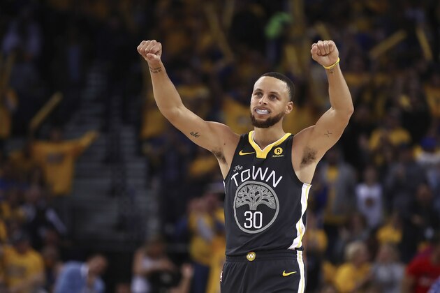 Golden State Warriors' Stephen Curry (30) celebrates a score against the New Orleans Pelicans during the second half in Game 2 of a second-round NBA basketball playoff series Tuesday, May 1, 2018, in Oakland, Calif. (AP Photo/Ben Margot)