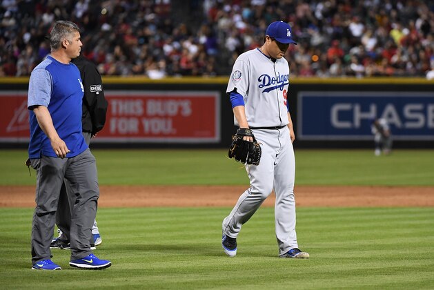 PHOENIX, AZ - MAY 02:  Hyun-Jin Ryu #99 of the Los Angeles Dodgers leaves the game after sustaining an injury during the second inning against the Arizona Diamondbacks at Chase Field on May 2, 2018 in Phoenix, Arizona.  (Photo by Norm Hall/Getty Images)