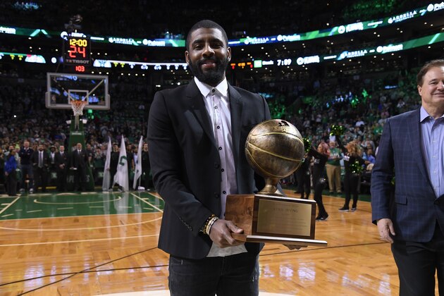 BOSTON, MA - APRIL 24:  Kyrie Irving #11 of the Boston Celtics receives the Red Auerbach award prior to Game Five of Round One of the 2018 NBA Playoffs against the Milwaukee Bucks on April 24, 2018 at the TD Garden in Boston, Massachusetts.  NOTE TO USER: User expressly acknowledges and agrees that, by downloading and or using this photograph, User is consenting to the terms and conditions of the Getty Images License Agreement. Mandatory Copyright Notice: Copyright 2018 NBAE  (Photo by Brian Babineau/NBAE via Getty Images)