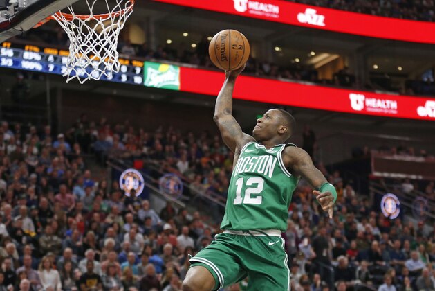 Boston Celtics guard Terry Rozier (12) goes to the basket in the second half during an NBA basketball game against the Utah Jazz Wednesday, March 28, 2018, in Salt Lake City. (AP Photo/Rick Bowmer)