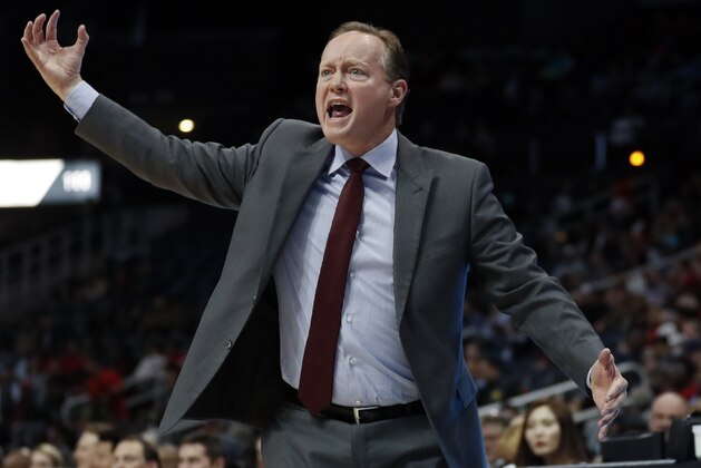 Atlanta Hawks coach Mike Budenholzer argues with an official during the first half of the team's NBA basketball game against the Charlotte Hornets on Wednesday, Jan. 31, 2018, in Atlanta. (AP Photo/John Bazemore)