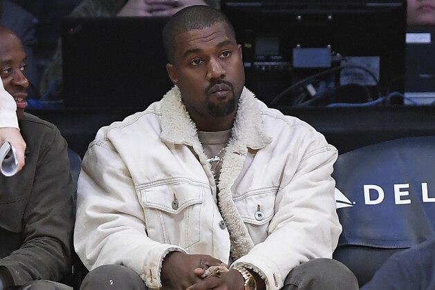 Kanye West watches during the first half of an NBA basketball game between the Los Angeles Lakers and the Memphis Grizzlies, Sunday, Nov. 5, 2017, in Los Angeles. (AP Photo/Mark J. Terrill)