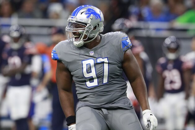 Detroit Lions defensive tackle Akeem Spence (97) reacts after a sack during the second half of an NFL football game against the Chicago Bears, Saturday, Dec. 16, 2017, in Detroit. (AP Photo/Rey Del Rio)