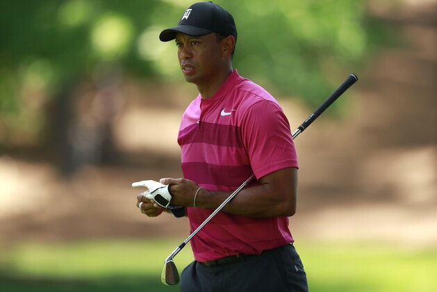 Tiger Woods walks down the second fairway during the first round of the Wells Fargo Championship golf tournament at Quail Hollow Club in Charlotte, N.C., Thursday, May 3, 2018. (AP Photo/Jason E. Miczek)