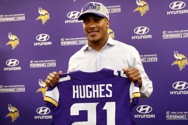 Mike Hughes poses for photos at a news conference introducing him as the Minnesota Vikings' selection from the first round of the NFL football draft Friday, April 27, 2018, in Eagan, Minn. (AP Photo/Andy Clayton-King)