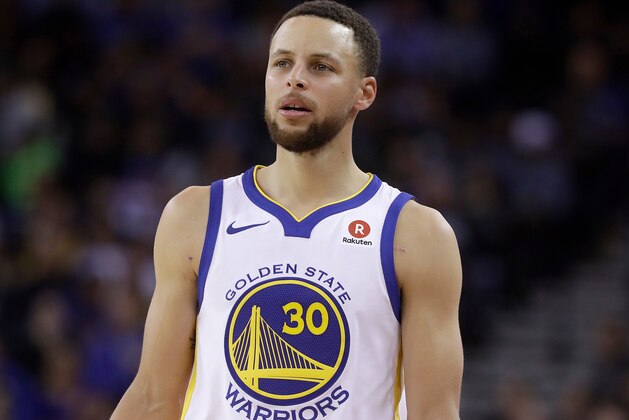 FILE - This March 6, 2018 file photo shows Golden State Warriors guard Stephen Curry during an NBA basketball game against the Brooklyn Nets in Oakland, Calif.  Sony Pictures Entertainment announced Monday, April 23, that it has struck a deal with the Golden State Warriors All-Star guard to produce television, film and possibly gaming projects. (AP Photo/Jeff Chiu, File)