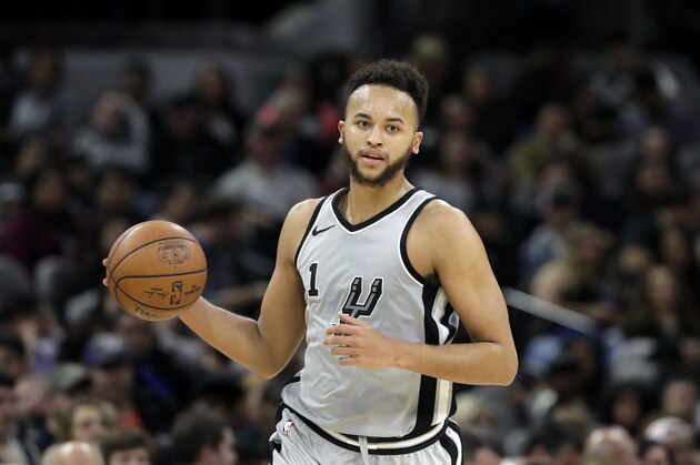 San Antonio Spurs forward Kyle Anderson (1) moves the ball up court during the second half of an NBA basketball game against the Denver Nuggets, Saturday, Jan. 13, 2018, in San Antonio. San Antonio won 112-80. (AP Photo/Eric Gay)