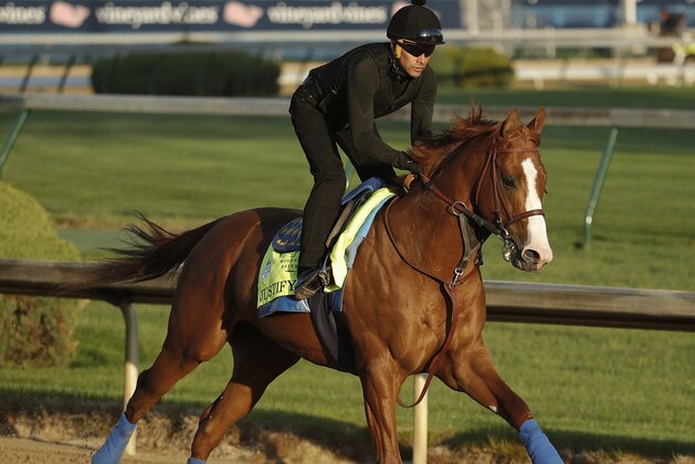 Kentucky Derby hopeful Justify runs during a morning workout at Churchill Downs Tuesday, May 1, 2018, in Louisville, Ky. The 144th running of the Kentucky Derby is scheduled for Saturday, May 5. (AP Photo/Charlie Riedel)