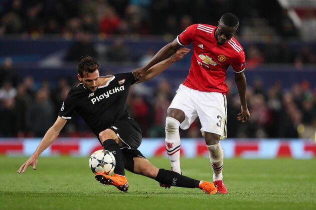 MANCHESTER, ENGLAND - MARCH 13: Franco Vanquez of Sevilla and Eric Bailly of Manchester United during the UEFA Champions League Round of 16 Second Leg match between Manchester United and Sevilla FC at Old Trafford on March 13, 2018 in Manchester, United Kingdom. (Photo by Matthew Ashton - AMA/Getty Images)