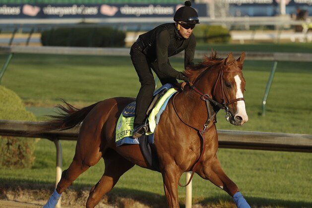 Kentucky Derby hopeful Justify runs during a morning workout at Churchill Downs Tuesday, May 1, 2018, in Louisville, Ky. The 144th running of the Kentucky Derby is scheduled for Saturday, May 5. (AP Photo/Charlie Riedel)