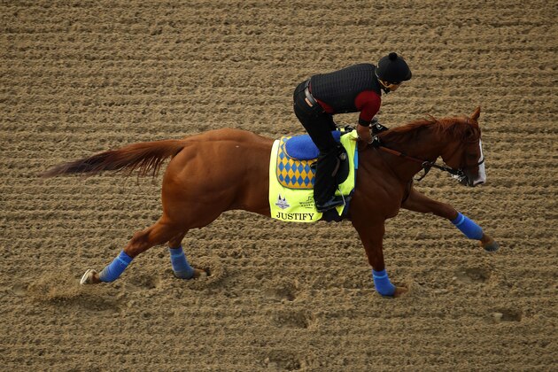 Kentucky Derby entrant Justify runs during a morning workout at Churchill Downs Wednesday, May 2, 2018, in Louisville, Ky. The 144th running of the Kentucky Derby is scheduled for Saturday, May 5. (AP Photo/Charlie Riedel)