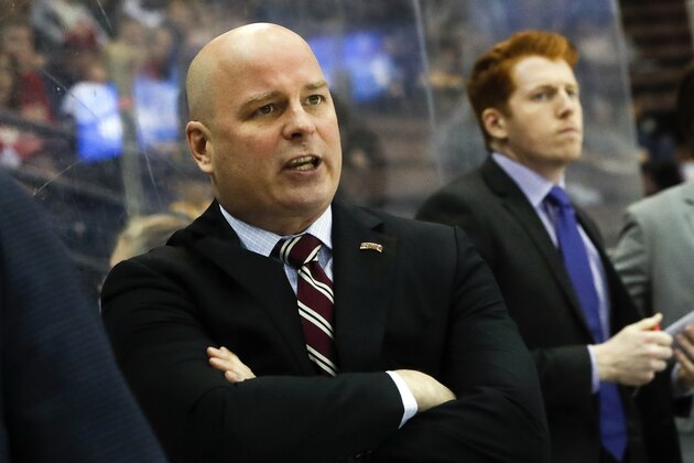 FILE - In this March 25, 2017, file photo, Denver head coach Jim Montgomery works the bench during the first period in the regional semifinals of the NCAA college hockey tournament against Michigan Tech in Cincinnati.  A person with knowledge of the situation tells The Associated Press that the Dallas Stars will hire Montgomery to be their next head coach. Montgomery takes over Ken Hitchcock, who retired last month and will become a consultant for the Stars. The person spoke on condition of anonymity Wednesday, May 2, 2018,  because the hiring had not been announced. (AP Photo/John Minchillo, File)