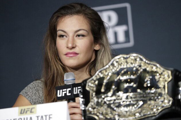 FILE--In this July 6, 2016, file photo, Miesha Tate speaks during a UFC 200 mixed martial arts news conference in Las Vegas. Tate says she's inspired by the tough little girl who broke her arm while hiking near Las Vegas; the mixed martial arts fighter carried the child back down the mountain. Tate posted on Facebook that she encountered the 6-year-old Sunday, Sept. 4, 2016, on the popular Mary Jane Falls trail of Mount Charleston, about 40 miles northwest of Las Vegas. (AP Photo/John Locher, file)