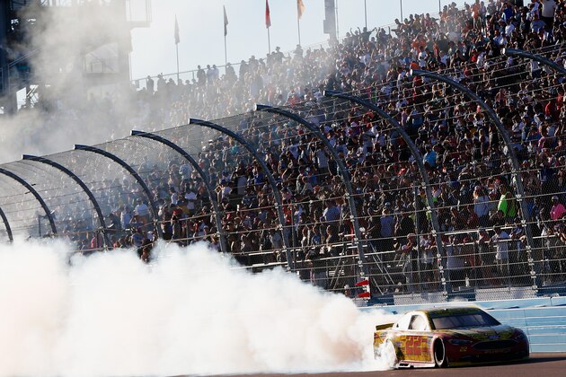 AVONDALE, AZ - NOVEMBER 13:  Joey Logano, driver of the #22 Shell Pennzoil Ford, celebrates with a burnout after winning the NASCAR Sprint Cup Series Can-Am 500 at Phoenix International Raceway on November 13, 2016 in Avondale, Arizona.  (Photo by Jonathan Ferrey/Getty Images)