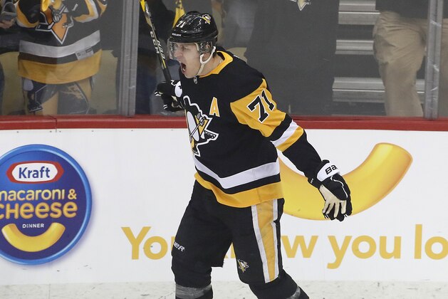 Pittsburgh Penguins' Evgeni Malkin celebrates his goal during the period in Game 1 of an NHL first-round hockey playoff series against the Philadelphia Flyers in Pittsburgh, Wednesday, April 11, 2018. (AP Photo/Gene J. Puskar)