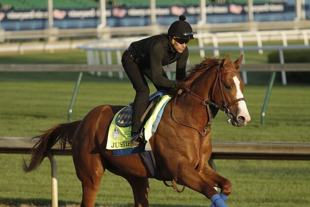 Kentucky Derby hopeful Justify runs during a morning workout at Churchill Downs Tuesday, May 1, 2018, in Louisville, Ky. The 144th running of the Kentucky Derby is scheduled for Saturday, May 5. (AP Photo/Charlie Riedel)